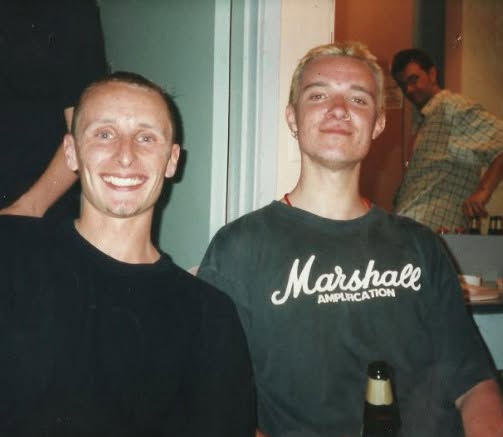 Old photograph of Jason Midro with a friend wearing a Marshall Amplification shirt