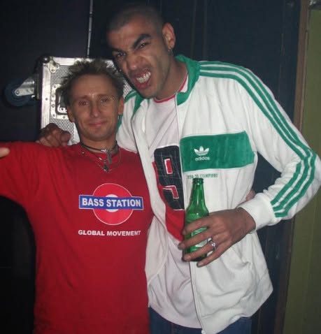 Old photograph of Jason Midro in a red Bass Station t-shirt with a friend