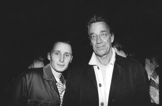 Black and white photograph of a young Jason Midro with an older man