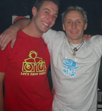 Two friends in graphic t-shirts at a club night