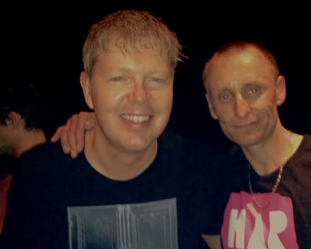 Two friends smiling together at a club night